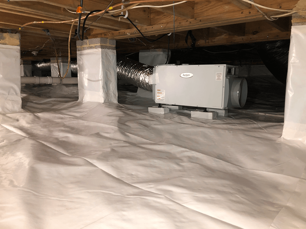 a waterproofed pier and beam foundation, cinder block piers in the middle hold up the wooden beams that are the base of the floor