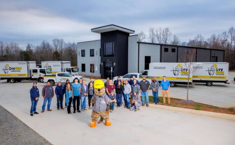 Dry Otter Team, building, and truck, including otter mascot