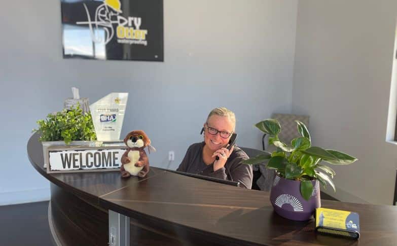 Carmyn answers the phone with a smile