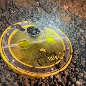 Dry Otters own drain set in the crawlspace of the home. Yellow top with the Drydsale Logo on top